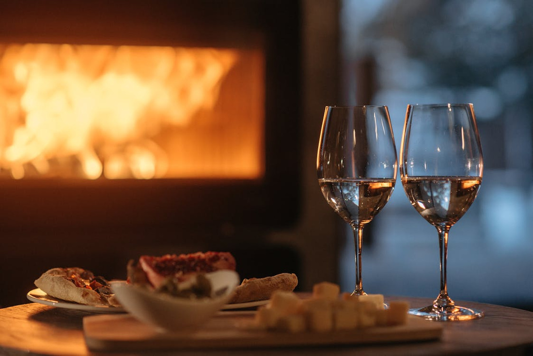 cozy wine by fireplace