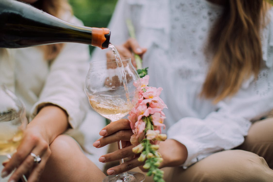 Person Pouring Sparkling Wine